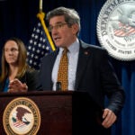U.S. Attorney District of Massachusetts Joshua Levy, right, faces reporters as Special Agent in Charge FBI, Boston Division Jodi Cohen, left, looks on during a news conference, Monday, Dec. 16, 2024, at the federal courthouse, in Boston.