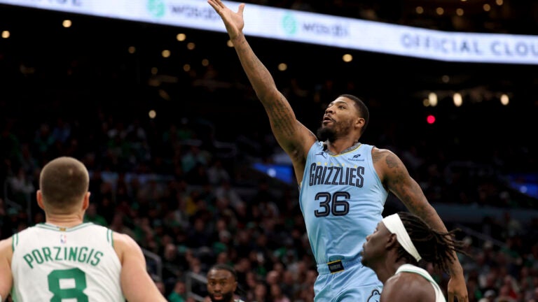 In return, Marcus Smart wears Memphis blues and a touch of green