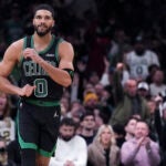 Boston Celtics forward Jayson Tatum (0) celebrates after hitting a 3-point basket during the second half of an NBA basketball game against the Miami Heat, Monday, Dec. 2, 2024, in Boston.