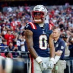 Christian Gonzalez looks to the crowd after breaking up a Cardinals touchdown pass.