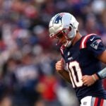 FOXBOROUGH, MASSACHUSETTS - NOVEMBER 17: Drake Maye #10 of the New England Patriots runs off the field with his head down during the game against the Los Angeles Rams at Gillette Stadium on November 17, 2024 in Foxborough, Massachusetts.