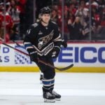 Jakob Chychrun of the Washington Capitals looks on after scoring a goal against the Boston Bruins during the first period.