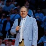 Bill Belichick speaks to the crowd at a UNC basketball game.
