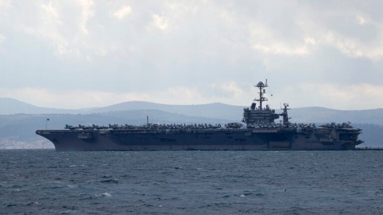 FILE - Aircraft carrier USS Harry S. Truman is moored near Split, Croatia, Feb. 14, 2022.