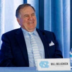 Bill Belichick laughs during an NCAA college football press conference in Chapel Hill, N.C.