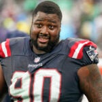 New England Patriots defensive tackle Christian Barmore (90) stands on the sideline during an NFL football game against the New York Jets on Sunday Sept. 24, 2023, in New York. New England Patriots defensive tackle Christian Barmore has agreed to a four-year contract extension worth up to $92 million, according to a person with knowledge of the deal. The person confirmed the deal to The Associated Press on the condition of anonymity on Monday, April 29, 2024, because it has not been announced.