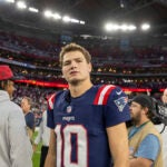 New England Patriots quarterback Drake Maye (10) exits the field after the Arizona Cardinals defeat the Patriots 30-17 in an NFL football game, Sunday, Dec. 15, 2024, in Glendale, Ariz.