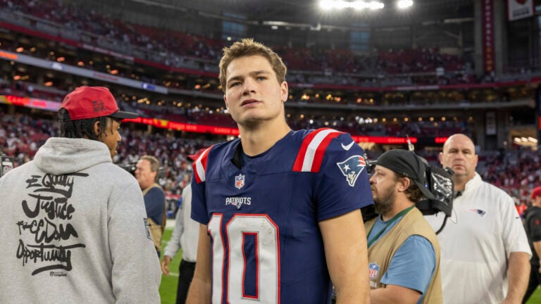 New England Patriots quarterback Drake Maye (10) exits the field after the Arizona Cardinals defeat the Patriots 30-17 in an NFL football game, Sunday, Dec. 15, 2024, in Glendale, Ariz.