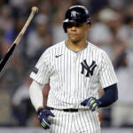 New York Yankees' Juan Soto reacts after being walked during the seventh inning of a baseball game against the Boston Red Sox Friday, Sept. 13, 2024, in New York.