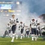 JACKSONVILLE, FLORIDA - FEBRUARY 06: Quarterback Tom Brady #12 of the New England Patriots leads his team onto the field before the start of Super Bowl XXXIX against the Philadelphia Eagles at Alltel Stadium on February 6, 2005 in Jacksonville, Florida.