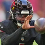 Cardinals quarterback Kyler Murray warms up before a game against the Seahawks.