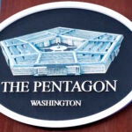 The Department of Defense logo is seen on the wall in the Press Briefing room at the Pentagon on Tuesday, Oct. 29, 2024 in Washington.