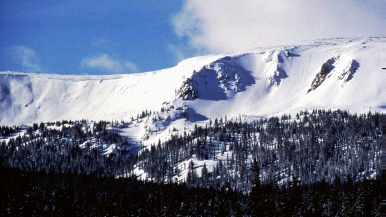 FILE - The sun shines onto Vasquez Cirque, new terrain for Winter Park Resort, Feb. 1997, Winter Park, Colo.