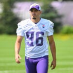 Former Vikings kicker John Parker Romo walks onto the field during training camp in Eagan, Minn., July 24, 2024.