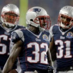 New England Patriots free safety Devin McCourty (32) reacts between teammates, outside linebacker Jerod Mayo (51) and cornerback Aqib Talib (31) in the third quarter an NFL football game in Foxborough, Mass., Sunday, Dec. 16, 2012.