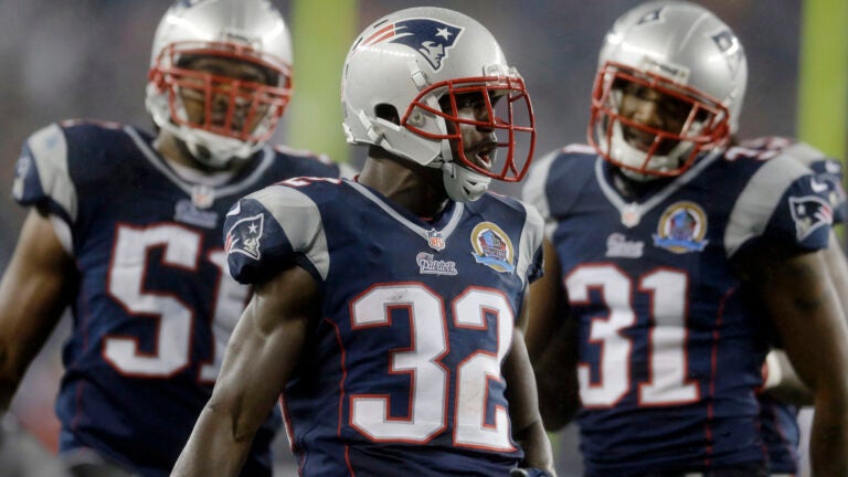 New England Patriots free safety Devin McCourty (32) reacts between teammates, outside linebacker Jerod Mayo (51) and cornerback Aqib Talib (31) in the third quarter an NFL football game in Foxborough, Mass., Sunday, Dec. 16, 2012.