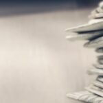 Pile of newspapers on white background