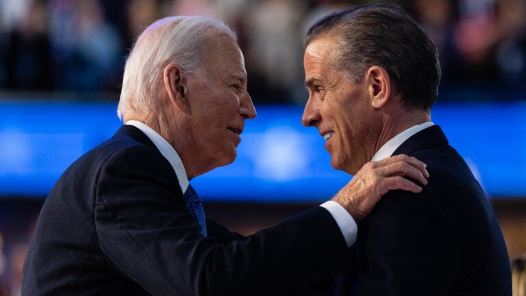 President Joe Biden hugs his son Hunter Biden after his speech on the first night of the Democratic National Convention in Chicago, August 19, 2024. President Biden granted a full and unconditional pardon to his son Hunter on Sunday, December 1, using the power from his office to put aside years of legal troubles, including a federal conviction for illegally purchasing a firearm.