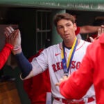 Boston Red Sox Triston Casas celebrates his 3 run home run in his dugout against the Minnesota Twins during third inning MLB action at Fenway Park.