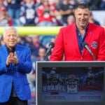 Former New England Patriots Mike VrabelÕs speaking at his New England Patriots Hall of Fame induction ceremony with owner Robert Kraft (background) during halftime against the Buffalo Bills during NFL action at Gillette Stadium.