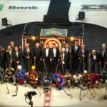 Boston Bruins legends and future stars pose for a photo before they play the Montreal Canadians during NHL action at TD Garden.