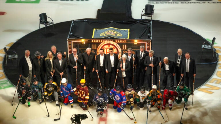 Boston Bruins legends and future stars pose for a photo before they play the Montreal Canadians during NHL action at TD Garden.