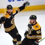 Boston-12/7/2024 Bruins vs Flyers—Boston Bruins left wing Brad Marchand (63) celebrates his 3rd period goal to tie. the game, 3-3 with Jordan Oesterie.