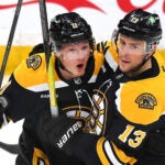 Boston Bruins center Trent Frederic (11)(left) is congratulated by Boston Bruins center Charlie Coyle (13) after his 2nd period goal.