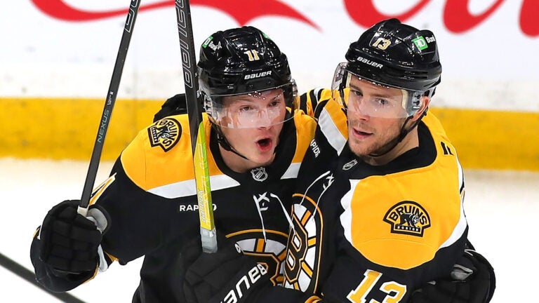 Boston Bruins center Trent Frederic (11)(left) is congratulated by Boston Bruins center Charlie Coyle (13) after his 2nd period goal.
