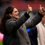 Bristol Bears' Ilona Maher gestures as she walks on the pitch.