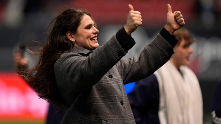 Bristol Bears' Ilona Maher gestures as she walks on the pitch.