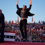 Elon Musk jumps on the stage.