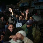 Palestinians celebrate the announcement of a ceasefire deal.
