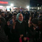 Palestinians celebrate the announcement of a ceasefire deal.