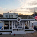 Workers continue with the finishing touches on the presidential reviewing stand.