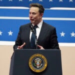 Elon Musk speaks at an indoor Presidential Inauguration parade event.