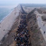An aerial photograph taken by a drone shows displaced Palestinians returning to their homes in the northern Gaza Strip.