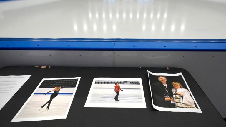 Photographs of aircraft crash victims from The Skating Club of Boston rink are displayed.
