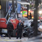 Security personnel investigate the scene on Bourbon Street after a vehicle drove into a crowd on New Orleans' Canal and Bourbon Street, Wednesday Jan. 1, 2025.