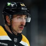 BOSTON, MASSACHUSETTS - JANUARY 23: Brad Marchand #63 of the Boston Bruins looks on during the third period against the Ottawa Senators at TD Garden on January 23, 2025 in Boston, Massachusetts. The Bruins defeat the Senators 2-0.