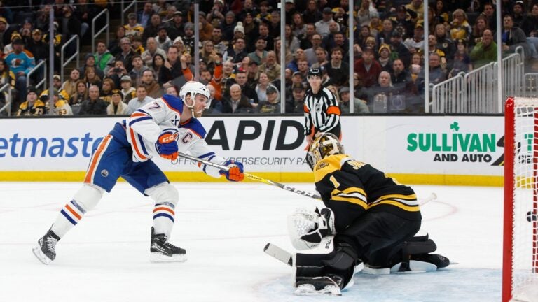 Connor McDavid of the Edmonton Oilers scores against Jeremy Swayman of the Bruins during the second period.