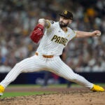 San Diego Padres relief pitcher Tanner Scott throws to an Atlanta Braves batter during the sixth inning in Game 2 of an NL Wild Card Series baseball game Wednesday, Oct. 2, 2024, in San Diego.