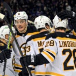 From left, Boston Bruins' Brad Marchand, Nikita Zadorov, Charlie McAvoy, David Pastrnak and Elias Lindholm celebrate after Lindholm scored during the second period of an NHL hockey game against the New York Rangers, Thursday, Jan. 2, 2025, in New York.