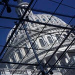 FILE - The Capitol dome on Capitol Hill is seen through a glass structure in Washington, on April 6, 2011.