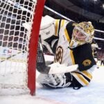 SUNRISE, FLORIDA - JANUARY 11: Jeremy Swayman #1 of the Boston Bruins keeps his eyes on the puck during the first period against the Florida Panthers at Amerant Bank Arena on January 11, 2025 in Sunrise, Florida. The Bruins defeated the Panthers 4-3 in overtime.