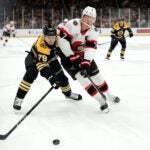 Michael Callahan #79 of the Boston Bruins and Brady Tkachuk #7 of the Ottawa Senators battle for control of the puck during the second period at TD Garden on January 23, 2025 in Boston, Massachusetts.