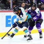 ST PAUL, MINNESOTA - JANUARY 04: Jill Saulnier #44 of the New York Sirens skates with the puck against Maggie Flaherty #19 of the Minnesota Frost in the second period at Xcel Energy Center on January 04, 2025 in St Paul, Minnesota.