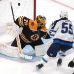 Winnipeg Jets center Mark Scheifele shoots the puck past Bruins goaltender Joonas Korpisalo for a goal during the third period.