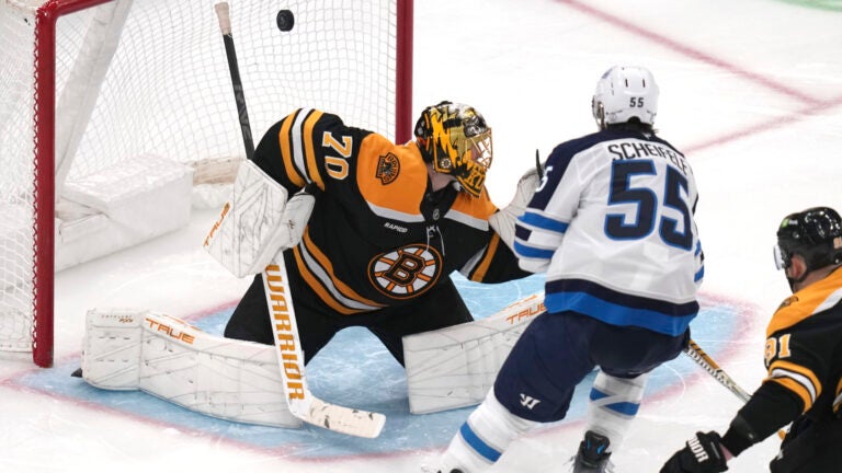 Winnipeg Jets center Mark Scheifele shoots the puck past Bruins goaltender Joonas Korpisalo for a goal during the third period.