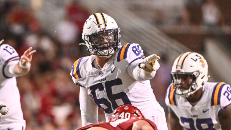 LSU offensive lineman Will Campbell (66) gets ready to run a play against Arkansas during an NCAA college football game Saturday, Oct. 19, 2024, in Fayetteville, Ark.
